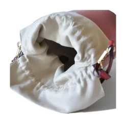 Skórzana torebka damska na rączce z łańcuszkiem "Secchiello" R335